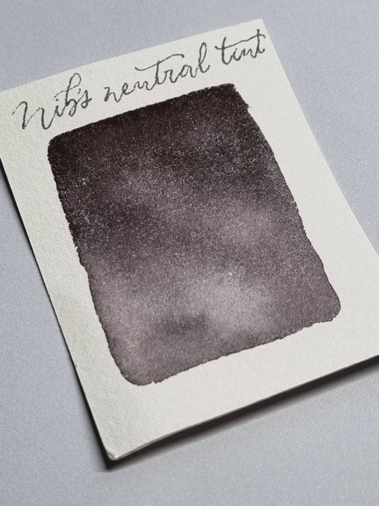 Handmade vegan watercolour paint | Nib's Neutral Tint | dark grey black, purple, green